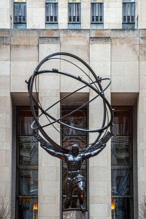 Photo for NEW YORK, USA - MARCH 6, 2020: Atlas, a bronze statue in Rockefeller Center, Midtown Manhattan. It is across on Fifth Avenue in St. Patrick's Cathedral. Sculptor Lee Lawrie and was installed in 1937. - Royalty Free Image