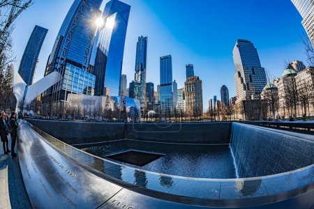 Photo for NEW YORK, USA - MARCH 9, 2020: Large angle view of Memorial of 11 September 2001, located in WTC Memorial Plaza, Manhattan. - Royalty Free Image