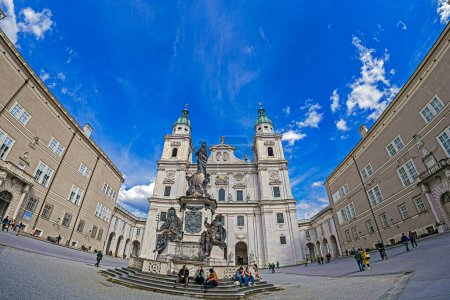 Photo for SALZBURG, AUSTRIA - 27 APR. 2023: Cathedral Square (Domplatz) with Marian Column Statue and Statue of the Virgin Mary. The statue of the Immaculate Conception (Mariensaule) is the center of the square - Royalty Free Image