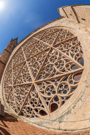 Photo for View of the Rose window from terrace of the Cathedral of Santa Maria of Palma, La Seu, a Gothic Roman-Catholic cathedral in Palma,Spain. Build begun by King James I of Aragon in 1229, finished in 1601 - Royalty Free Image