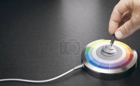 Photo for Choice of the best color harmony. Hand moving a pad to select colors on a palette. - Royalty Free Image