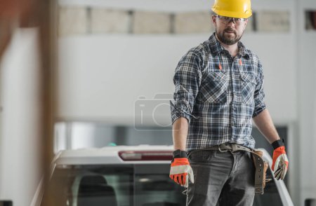 Photo for Professional Caucasian Contractor in His 30s Standing Indoors at Construction Site of Commercial Building Confidently Looking Ahead. - Royalty Free Image