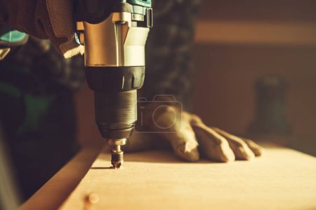 Photo for Woodwork Project Theme. Spinning Drill Driver with Wood Boring Bit Attached Close Up. - Royalty Free Image