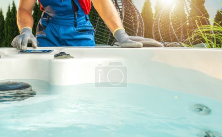 Photo for Caucasian Hot Tubs Technician Performing Residential Spa Necessary Pre Season Check - Royalty Free Image