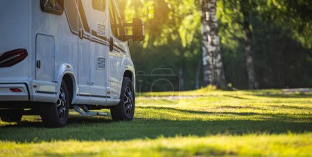 Photo for Modern Semi Integral Camper Van on a Sunny Campground RV Park. Vacation on the Road. - Royalty Free Image
