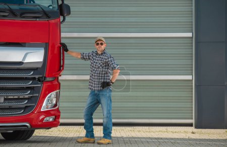 Photo for Professional Euro Trucker and His Brand New Semi Tractor Truck. Heavy Duty Transportation Industry. - Royalty Free Image
