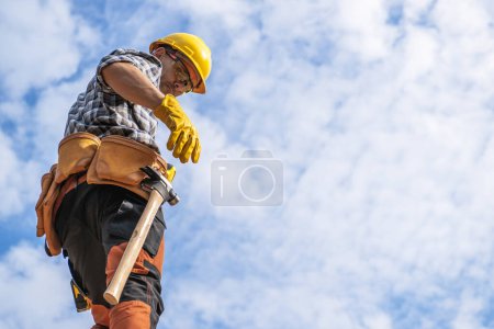 Photo for Caucasian Contractor Hard Hat Area Worker Staying Against Partly Cloudy Sky Preparing to Work - Royalty Free Image