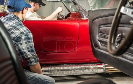 Photo for Caucasian Classic Car Owner is About to Sell His American Classic Vehicle to Other Enthusiast - Royalty Free Image