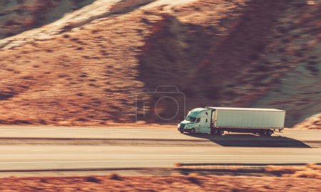 Photo for Speeding Semi Truck on the Utahs Interstate High 70. American Ground Transportation Industry. - Royalty Free Image