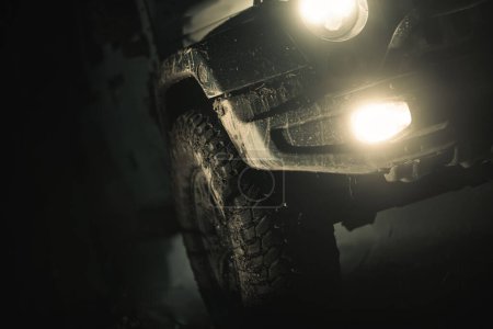 Photo for Night Time Off Road Driving Theme. AWD Vehicle Covered by Mud Close Up. - Royalty Free Image