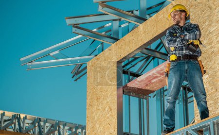 Photo for Caucasian Contractor Worker Assembling Skeleton Steel Frame of a Building - Royalty Free Image
