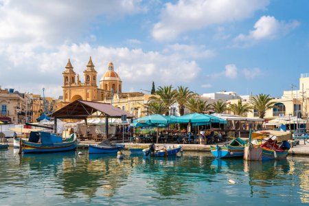 Foto de Marsaxlokk, MALTA - October 22, 2022: Landscape with harbor of Marsaxlokk, Malta - Imagen libre de derechos