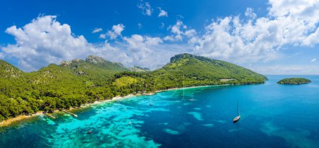 Photo for Aerial view Cala Formentor serene beauty, with its white sands, clear turquoise waters, and lush pine backdrop, a tranquil, picturesque escape in Mallorca. - Royalty Free Image