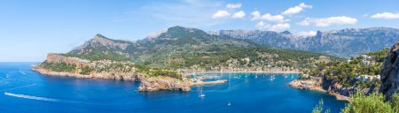 Photo for Port de Soller: a stunning snapshot where the UNESCO-protected Tramuntana Mountains meet the tranquil, azure waters of Mallorca's west coast. - Royalty Free Image