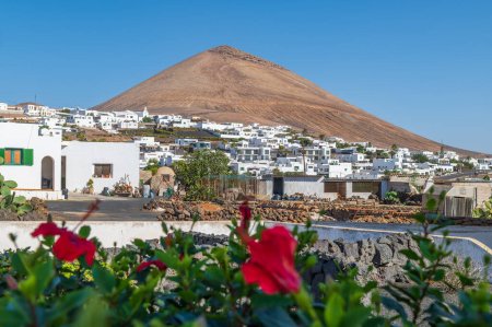 Photo for Charming view of Tias village against the iconic Montana Blanca in Lanzarote, capturing the essence of Canarian life and volcanic landscapes. - Royalty Free Image