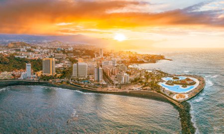 Puerto de la Cruz in Tenerife offers stunning ocean views, vibrant sunsets, and a tropical paradise. Enjoy the beachfront, luxury resorts, and urban charm.