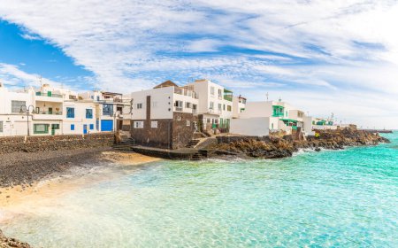 Punta Mujeres, Lanzarote: A charming traditional village with white houses, fishing boats, and stunning ocean views.