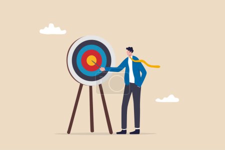 Specific goal, clarify objective or target, focus or concentrate on purpose to win business mission, perfection or aiming at target concept, businessman pointing at center of bullseye archery target.