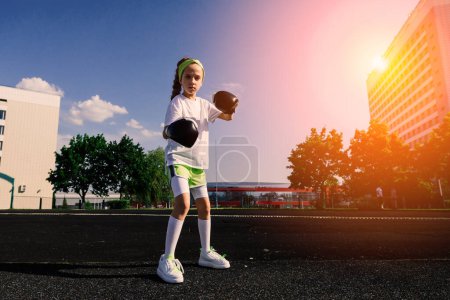 Photo for Female child boxer in gloves, feminism concept. Back to school, physical training. - Royalty Free Image