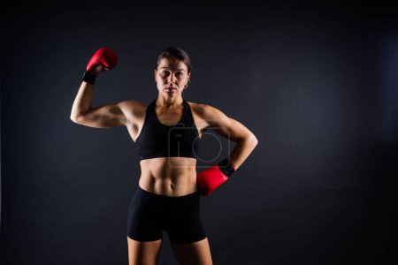 Photo for MMA female in a sports uniform ready to fight, defense of women from violence - Royalty Free Image