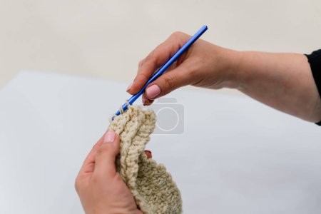 Photo for Process of a knitting isolated on white, female hands - Royalty Free Image
