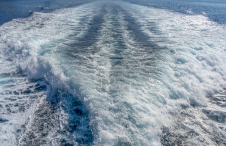Churning water surface at the back side of a motor boat