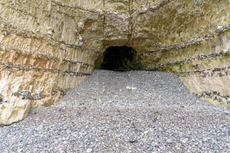 Cave in a chalk cliff seen near Fecamp, a commune in the department of Seine-Maritime at the Normandy region in northwestern France
