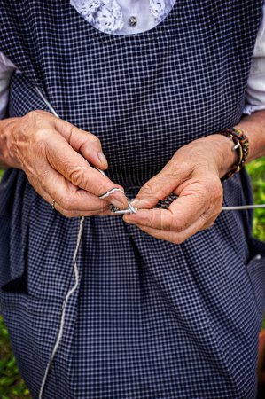 Photo for The hands of the elderly woman who knits - Royalty Free Image