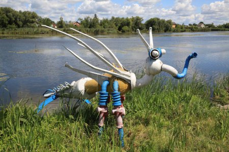 Photo for Sculptures of fairy-tale characters, created from metal and machine parts, on the city embankment in the city of Starokostyantiniv on the banks of the picturesque river Ikopot, Khmelnytskyi region, Ukraine - Royalty Free Image