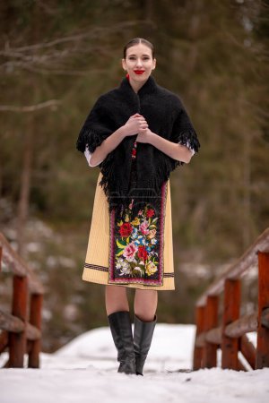 Photo for Young beautiful slovak woman in traditional dress. Slovak folklore - Royalty Free Image