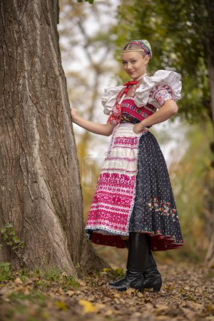 Photo for Beautiful woman wearing traditional Eastern Europe folk costumes. Slovak folk costumes. - Royalty Free Image
