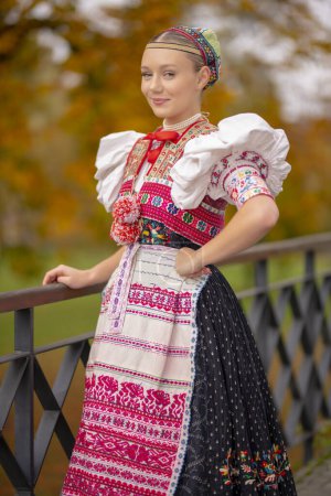 Photo for Beautiful woman wearing traditional Eastern Europe folk costumes. Slovak folk costumes. - Royalty Free Image