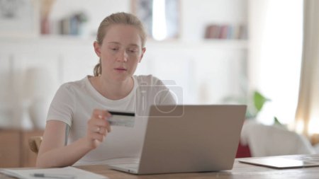 Photo for Young Woman making Successful Online Payment on Laptop - Royalty Free Image