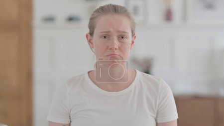Photo for Portrait of Crying Young Woman Feeling Sad at Home - Royalty Free Image