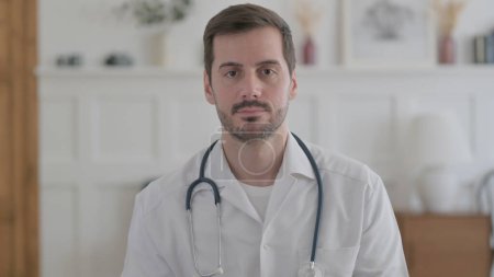 Photo for Portrait of Serious Male Doctor Looking at the Camera - Royalty Free Image