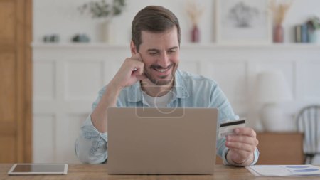 Photo for Happy Casual Man Shopping Online on Laptop - Royalty Free Image