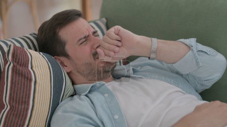 Photo for Casual Man Coughing while Sleeping in Bed - Royalty Free Image
