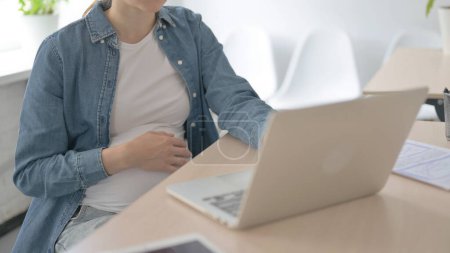 Photo for Pregnant Beautiful Woman Using Laptop for Work - Royalty Free Image