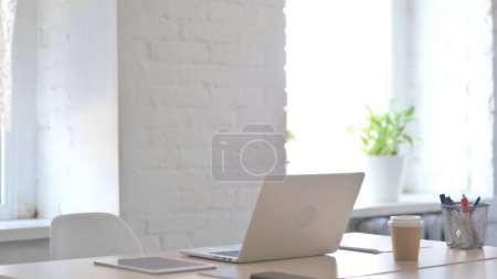 Photo for Young Adult Man Leaving Desk after Work - Royalty Free Image