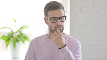 Photo for Portrait of Pensive Young Adult Man Thinking New Plan - Royalty Free Image