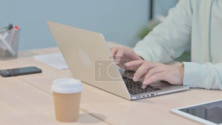 Photo for Close up of Hands Typing on Laptop - Royalty Free Image