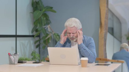 Photo for Senior Old Man having Headache while Working on Laptop - Royalty Free Image
