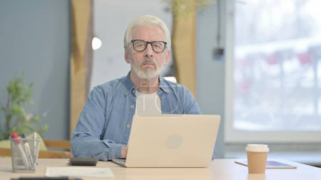 Photo for Senior Old Man Coming to Work on Laptop - Royalty Free Image