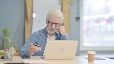 Photo for Happy Senior Old Man Shopping Online with Debit Card - Royalty Free Image