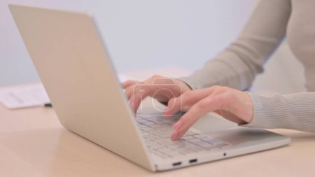 Photo for Creative Young Woman Coming to Work, Typing on Laptop - Royalty Free Image
