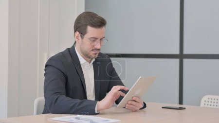 Photo for Businessman using Digital Tablet for Work - Royalty Free Image