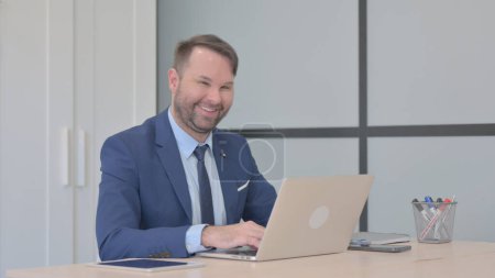 Photo for Yes, Businessman Shaking Head in Acceptance at Work - Royalty Free Image