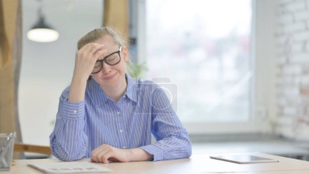 Photo for Angry Young Woman in Frustration Sitting at Work - Royalty Free Image