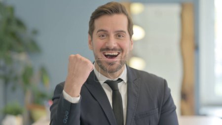 Photo for Portrait of Excited Businessman Celebrating Success - Royalty Free Image