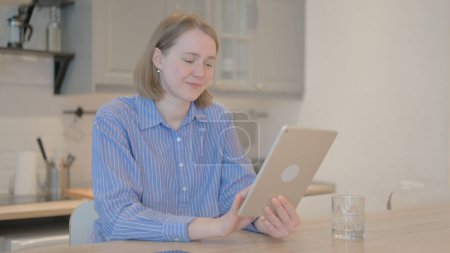 Photo for Cheerful Young Woman using Tablet Computer - Royalty Free Image